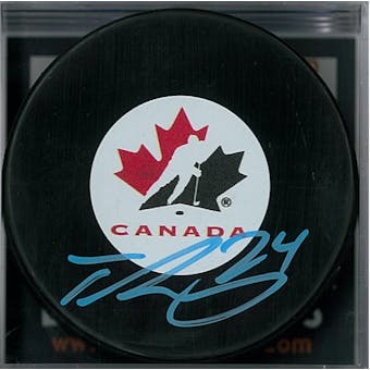 Ty Smith Autographed Team Canada Hockey Puck (DACW COA)
